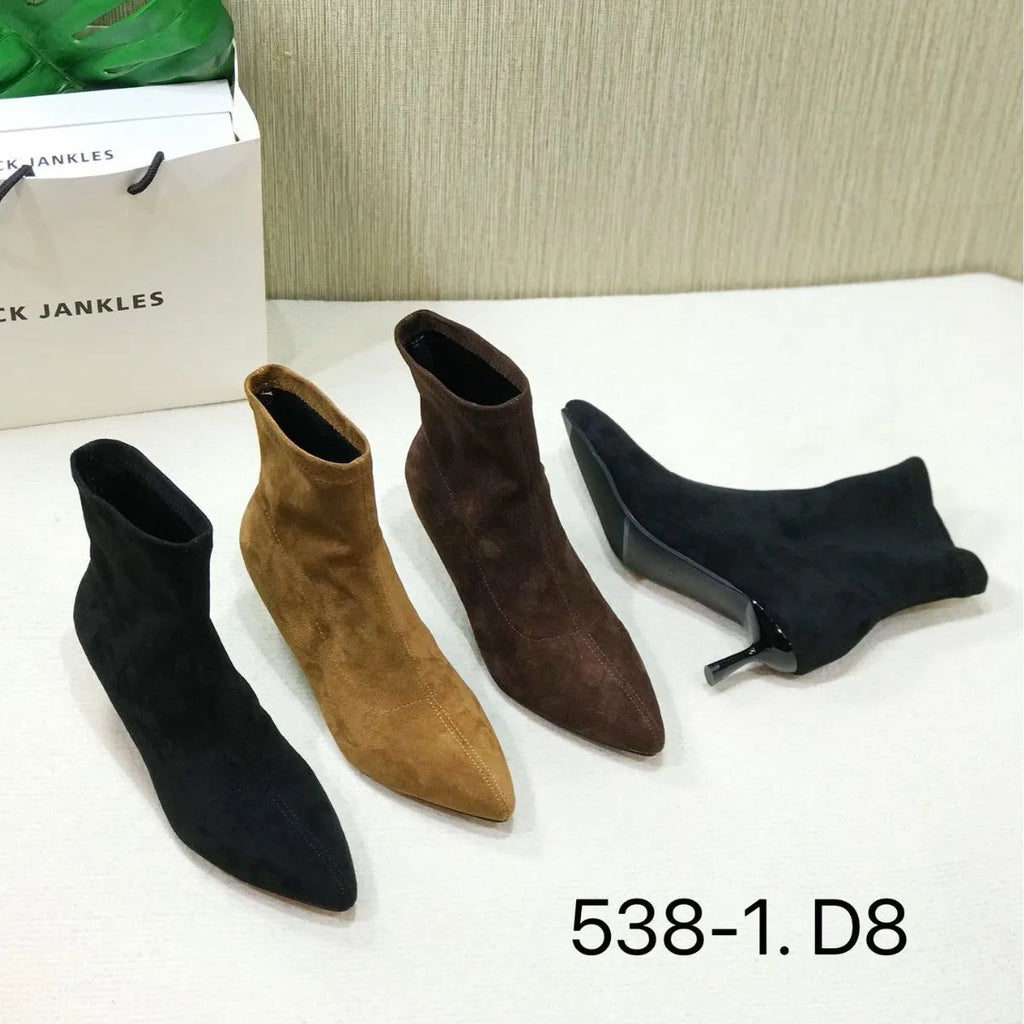 Women's black pointed toe ankle boots with a stiletto heel and mid-calf sock length.