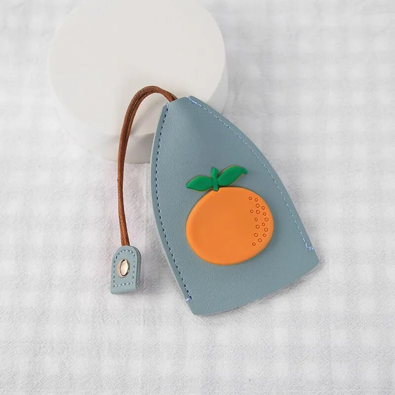 Cartoon pull-out key case in PU leather showing design options including resin fruit and big cartoon animal prints.