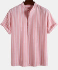 Loose fit short sleeve polo shirt with printed letter design on chest, shown in multiple colour options.