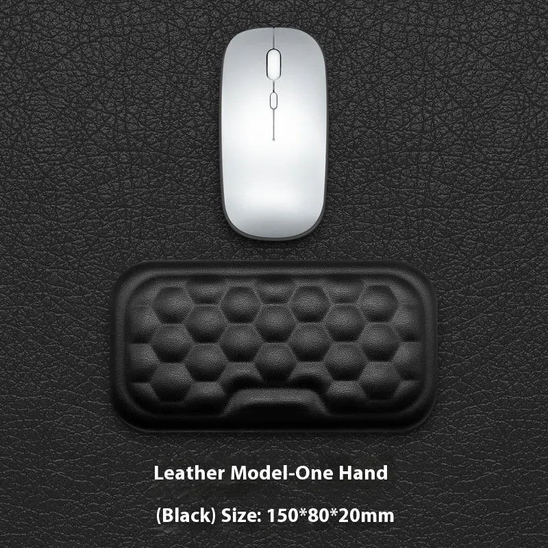 Customisable memory foam mouse wrist pad with black cloth cover on a desk.