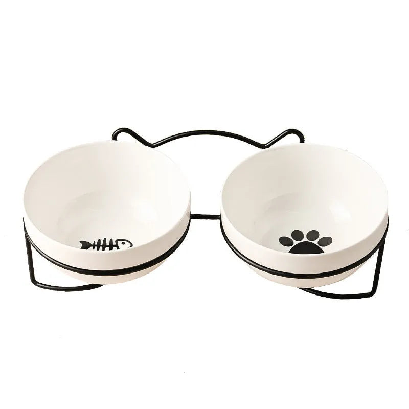 Ceramic cat bowl with iron frame stand showing cat paw print pattern and gold metal finish