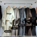 Women's loose fit wool blend cardigan three-piece set in beige, showing vest, coat, and casual pants.