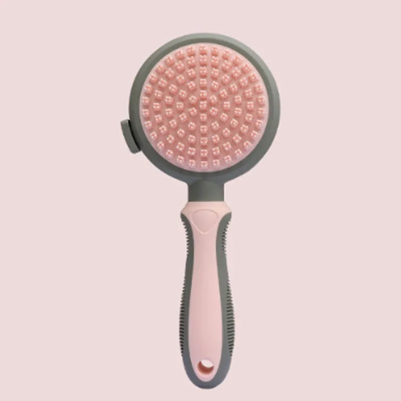 Green and pink 2-in-1 silicone cat grooming brush showing slicker brush and massage heads
