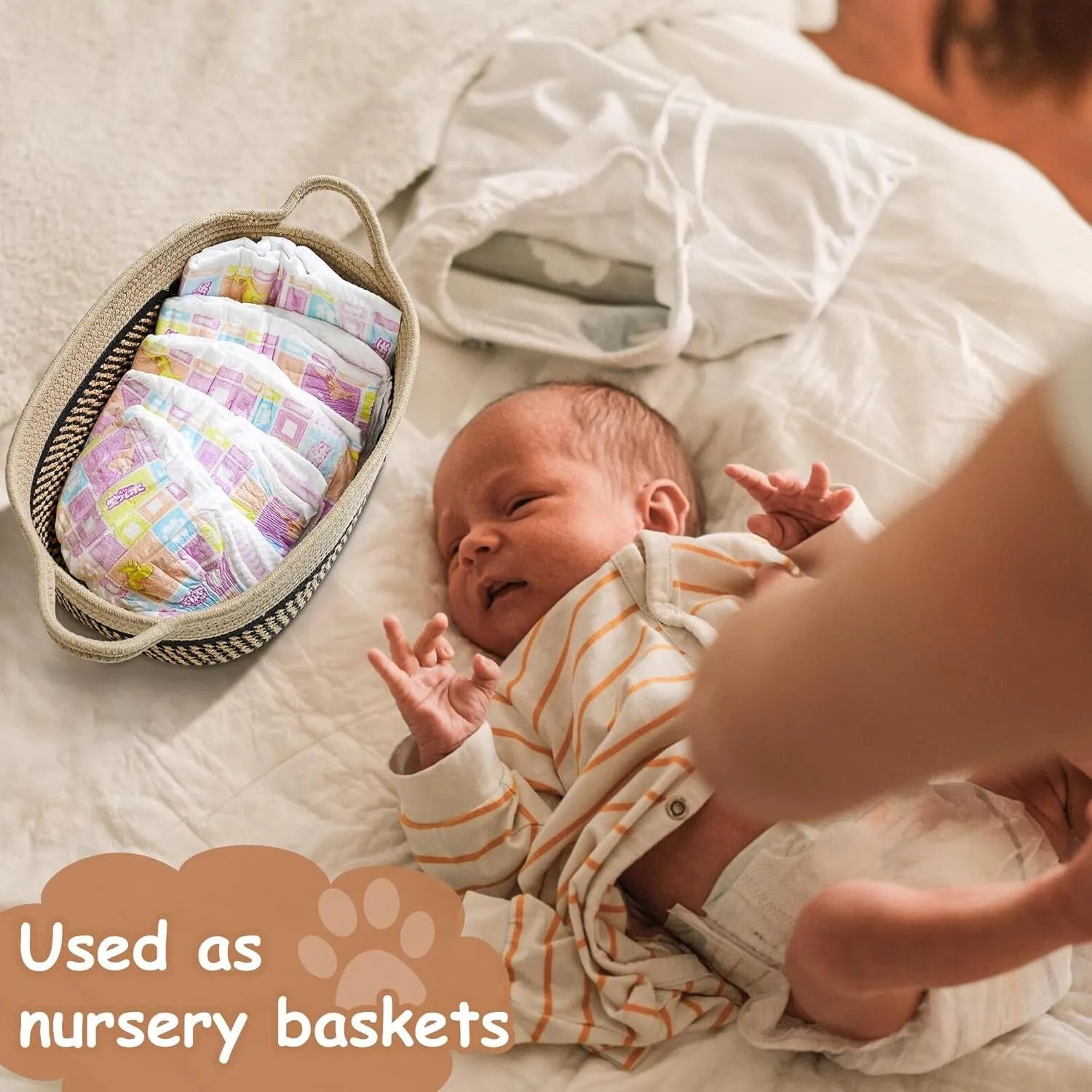 Light beige handmade cotton rope woven storage basket with a wooden handle on a table.
