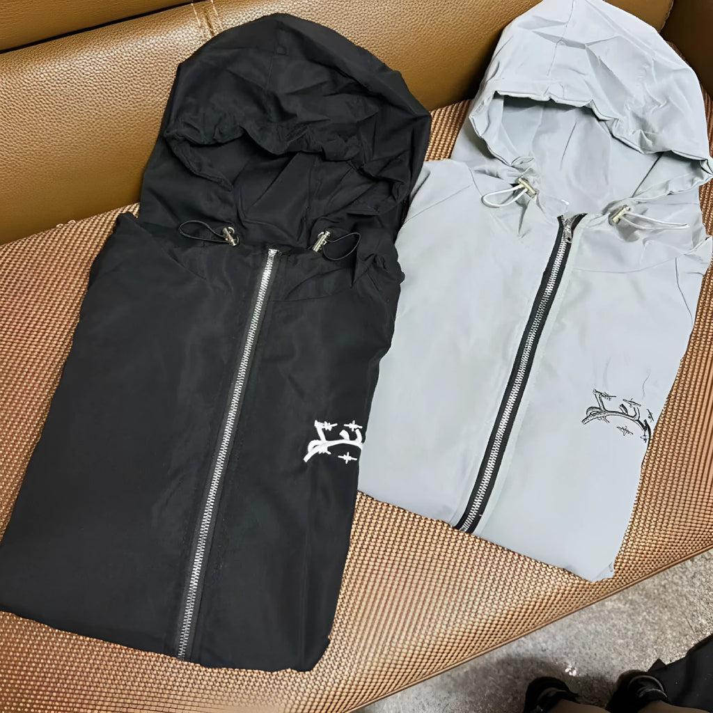 Men's grey British-style loose fit hooded sunscreen jacket made from polyester fabric