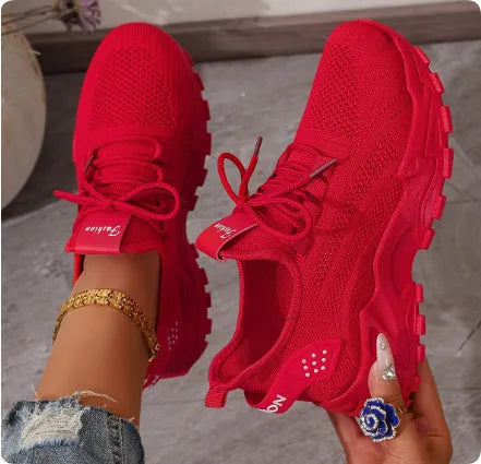 Women's low-top sneakers with mesh upper and platform sole in various colours.