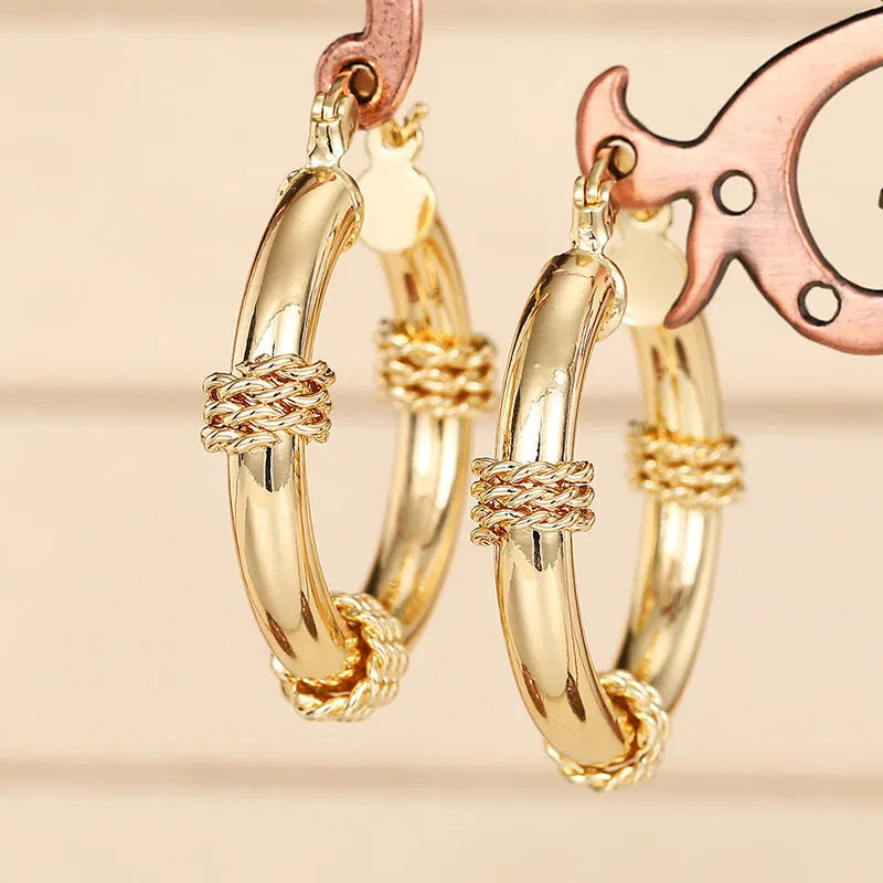 Copper geometric earrings for women in three golden colours with ring and line design elements