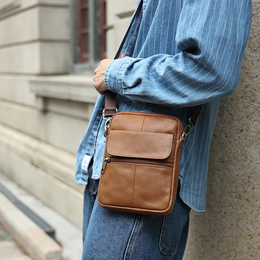 Men's brown leather crossbody shoulder bag with visible sewing lines and polyester cotton lining