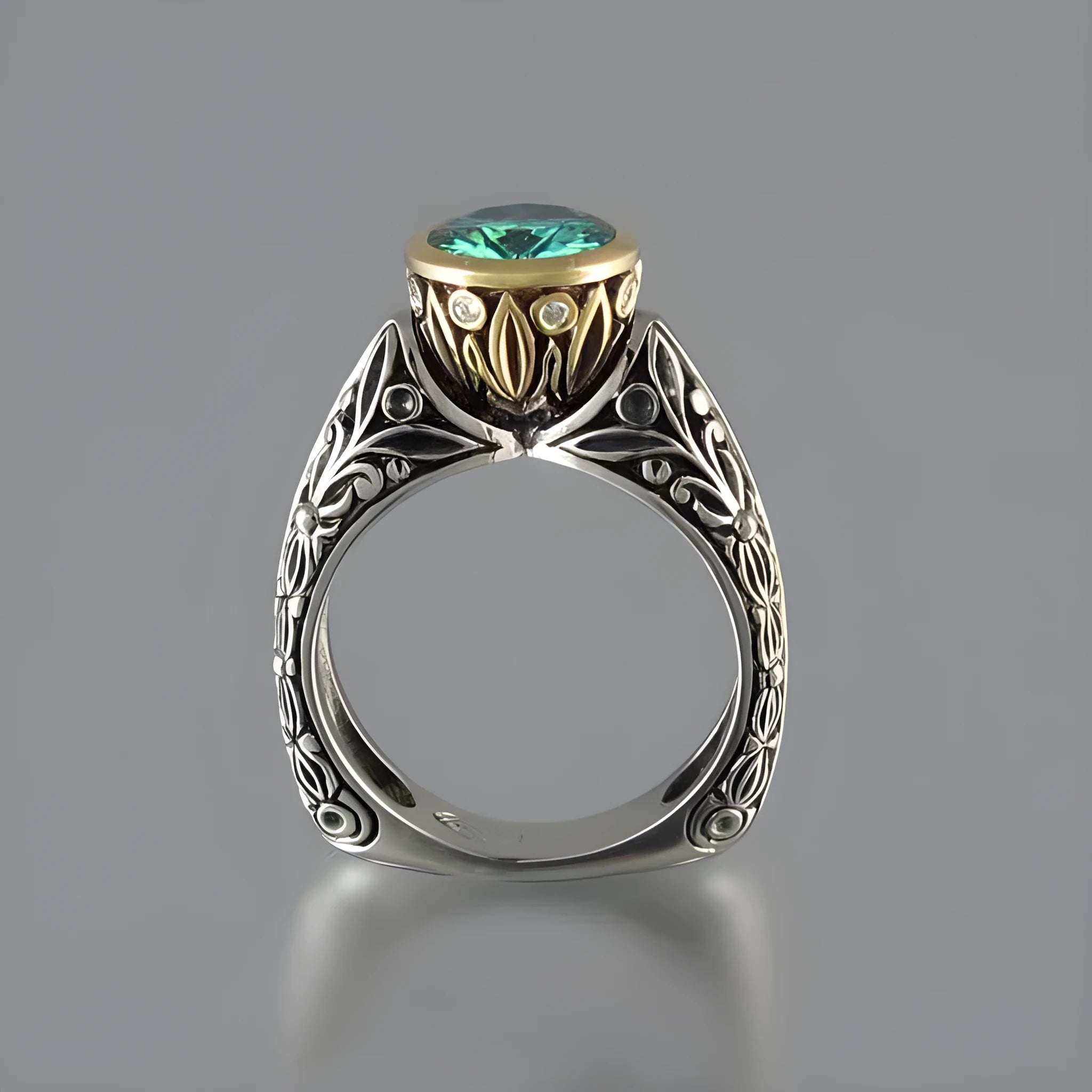 Gold-plated flower-shaped ring with emerald green gemstone in vintage design on finger