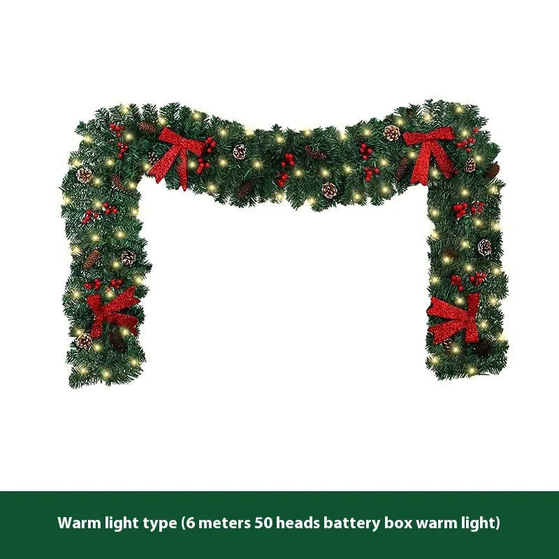 Christmas rattan decoration with PVC pine cone bow, available with optional LED lighting in warm white or coloured variants.