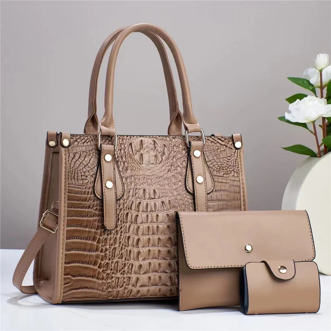 Contrast colour three-piece PU bag set showing crossbody bag, wallet, and card holder in burgundy.