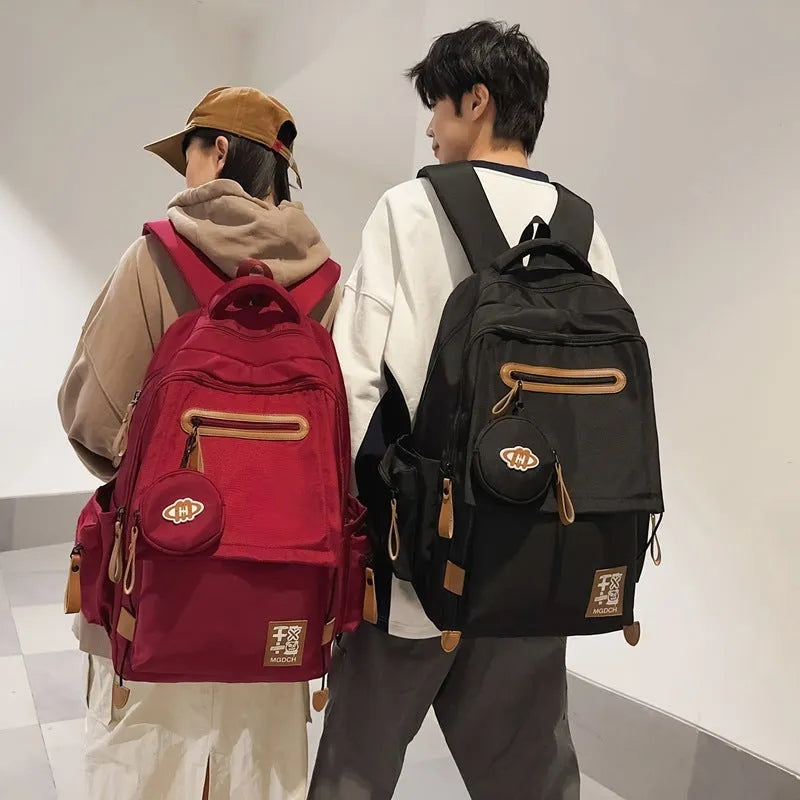 Large-capacity nylon school backpack for middle school students in solid colour with curved shoulder straps