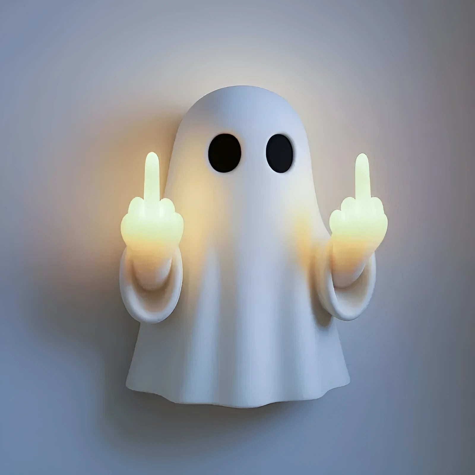 White ghost statue Halloween night lamp with LED lighting on black background
