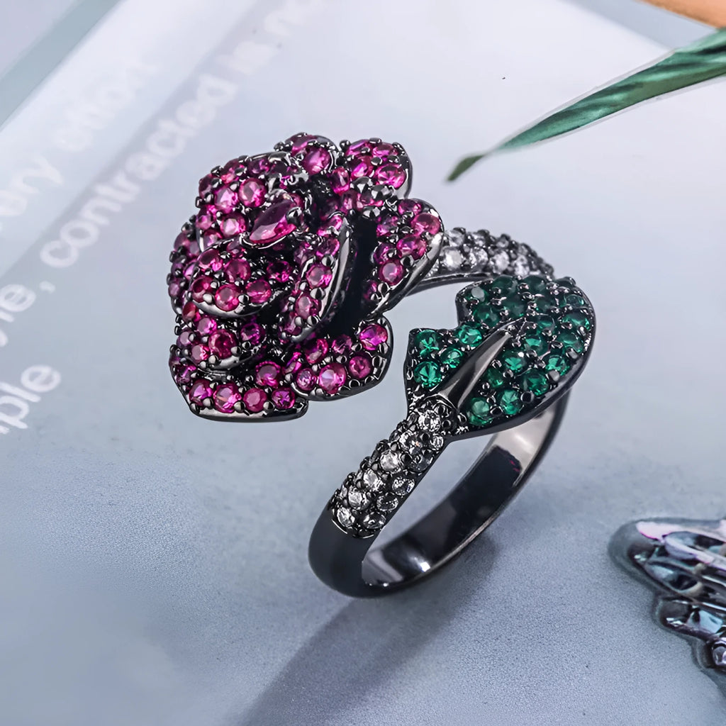 Black gold plated geometric floral ring with a red simulated corundum stone for women.