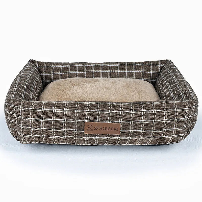 Grey plaid linen square dog bed for medium-sized dogs on a wooden floor.
