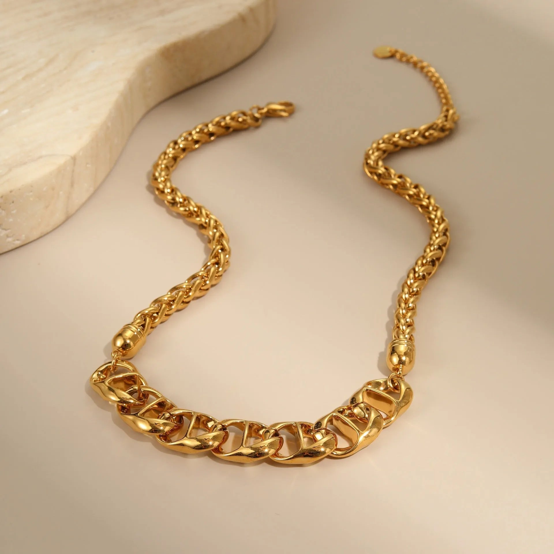Stainless steel necklace with gold electroplated finish and geometric pendant design