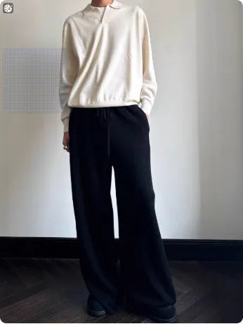 Pure wool polo sweater with lapel collar in loose fit, shown in milky white.