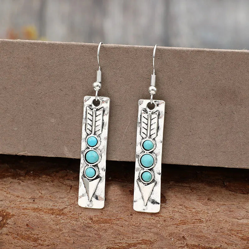 Silver geometric earrings with turquoise inlay on long strip zinc alloy design