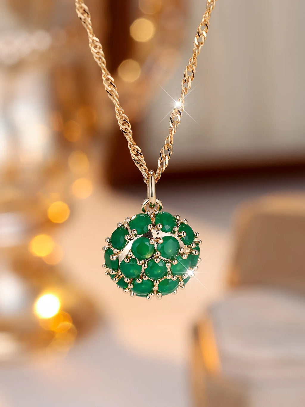 Round emerald pendant with full diamond setting on champagne gold chain necklace