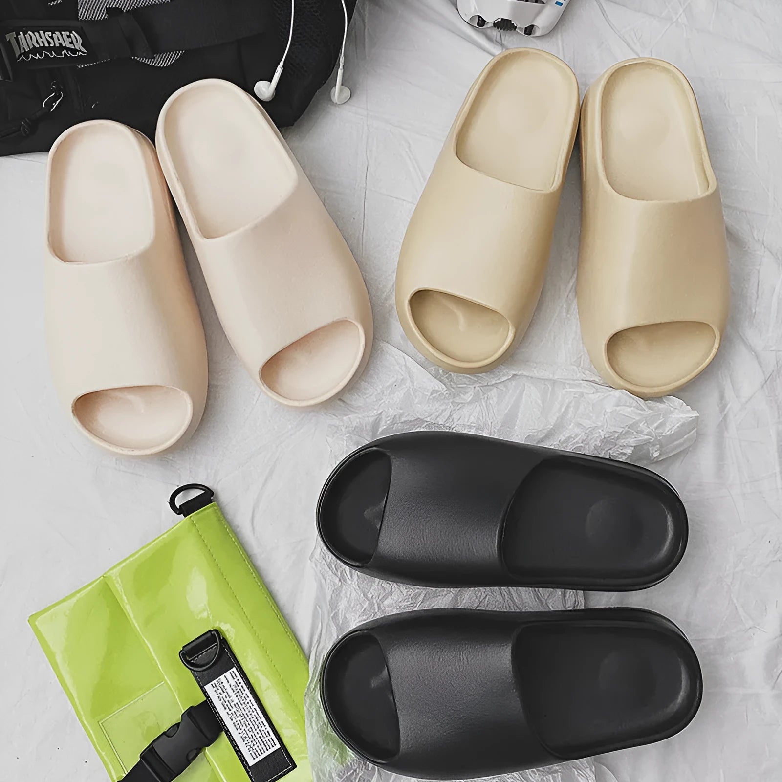 Women's thick-soled beach slippers in beige, black, brown, and green colours with injection moulded EVA construction.
