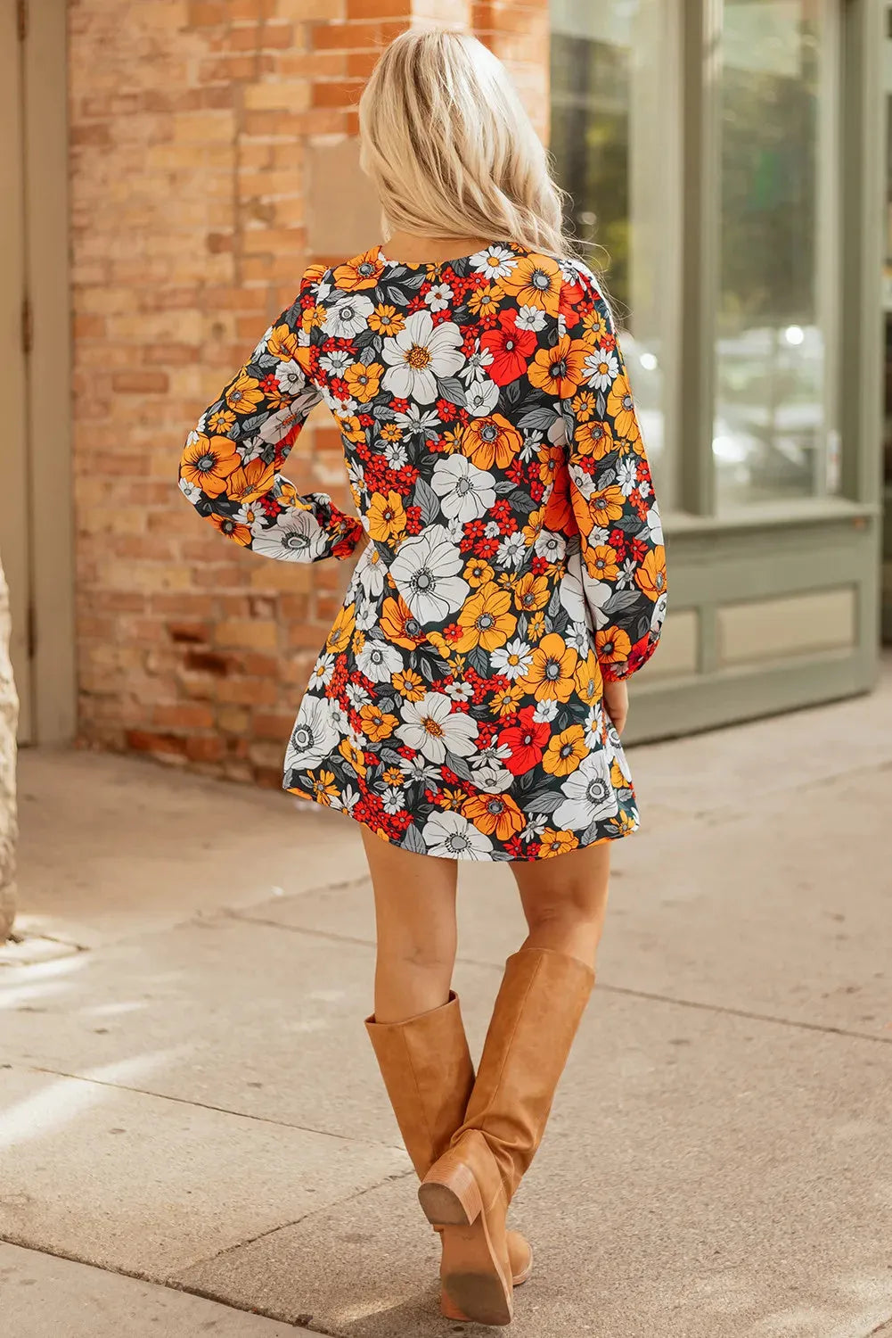 Orange floral print mini dress with lace-trimmed V-neck and long sleeves.