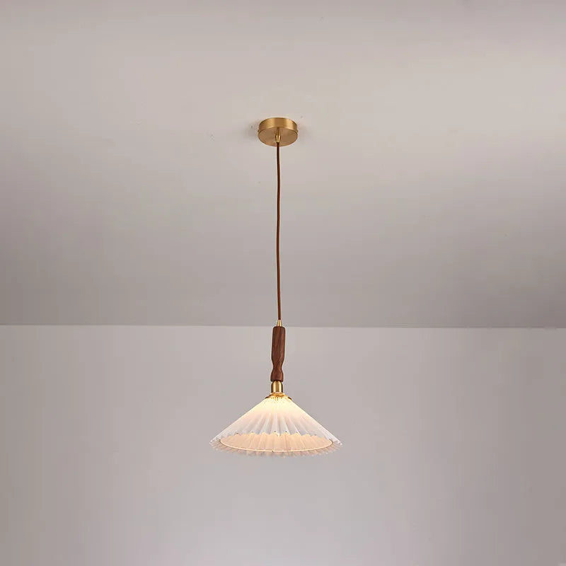Retro style wall lamp with rubber wood base and fabric shade in walnut finish