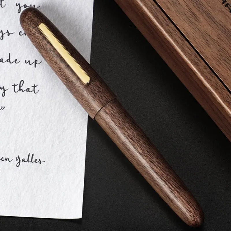 Wooden fountain pen with rotating cap showing natural wood grain