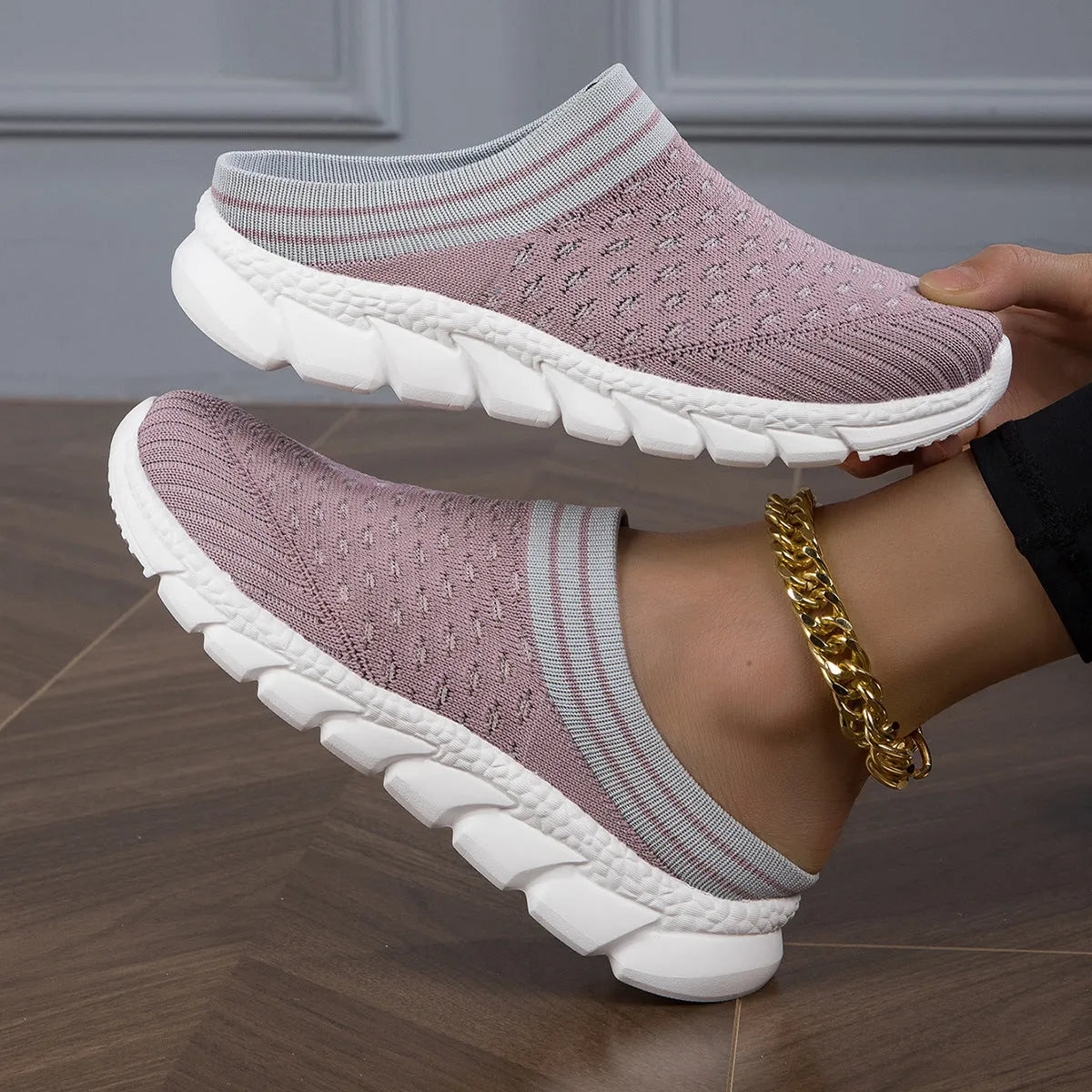 Women's black Flyknit semi slippers with hollowed-out sewing line detail and viscose sole