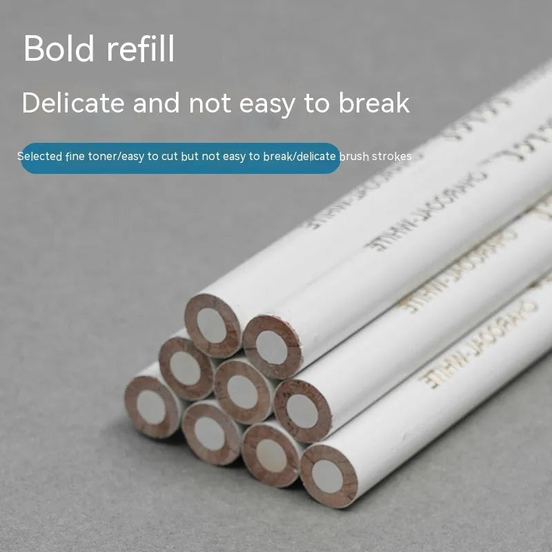 Three white charcoal pencils with wooden barrels and brush attachments for drawing