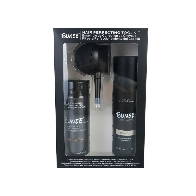 Box containing dense hair fibre powder canister, special applicator nozzle, and shaping spray bottle for hair styling.