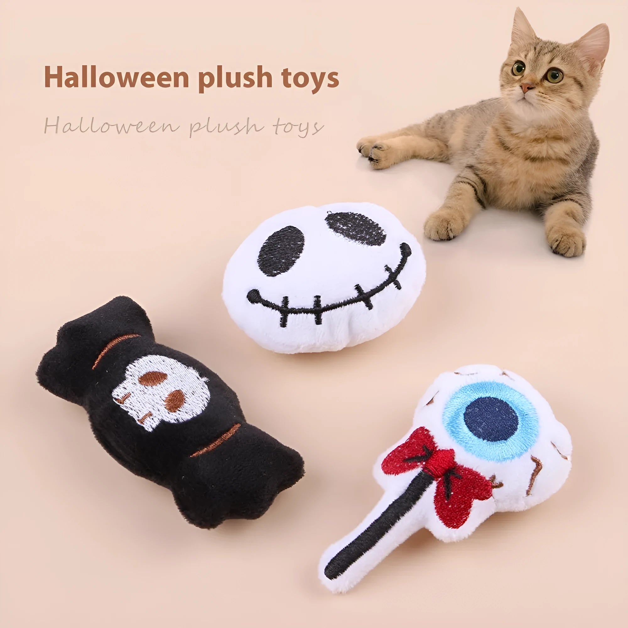 Plush cat wand toy with 27cm handle showing three interchangeable colourful heads: eyes, candy, and skull designs