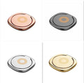 Magnetic ring holder with 360 degree rotating phone buckle in silver on a desk