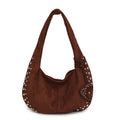A soft plush underarm tote handbag in a retro style, shown in a colour option.