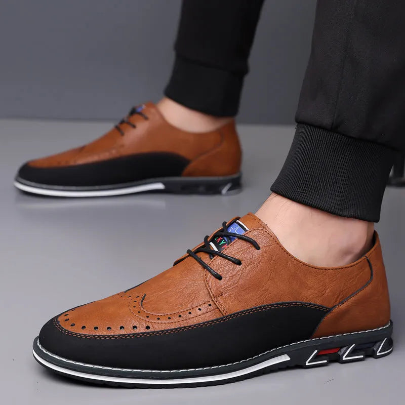 Men's black casual leather slip-on shoes with a rubber sole and visible sewing line details on a leather toe cap.