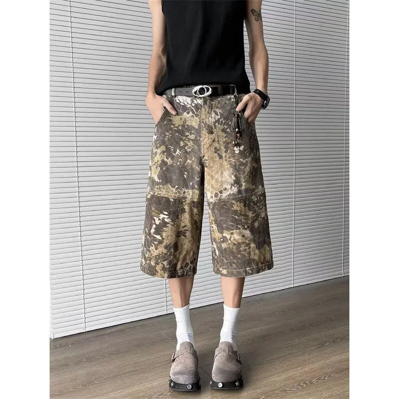 Yellow snake camouflage cropped jeans on a denim background