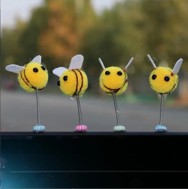 Swing spring bee car decoration with fur ball construction and cartoon design measuring 3x3cm