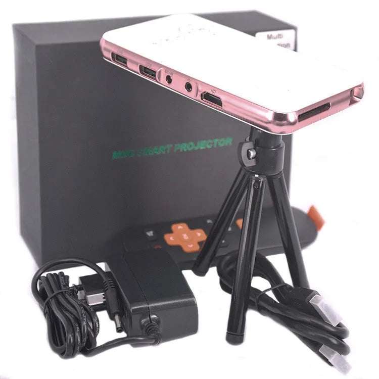 White and rose gold M6S miniature portable DLP Android projector with 32GB memory on a table.