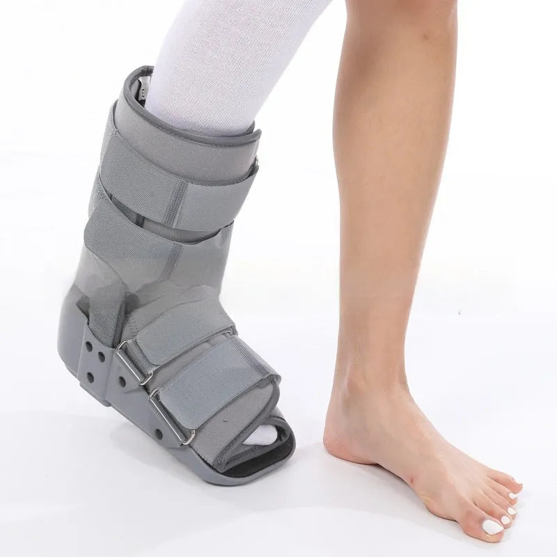 Grey Achilles tendon rehabilitation boot with aluminium struts and adjustable straps.