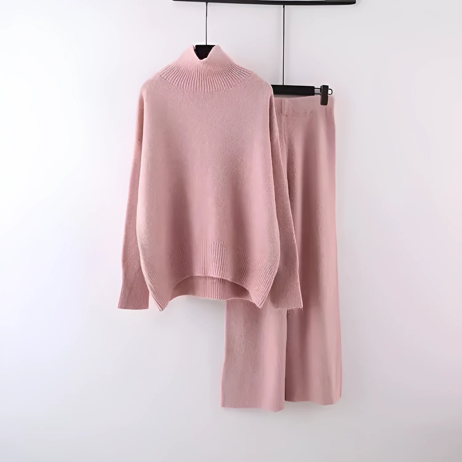 Women's beige acrylic sweater and wide-leg pants two-piece set laid flat.