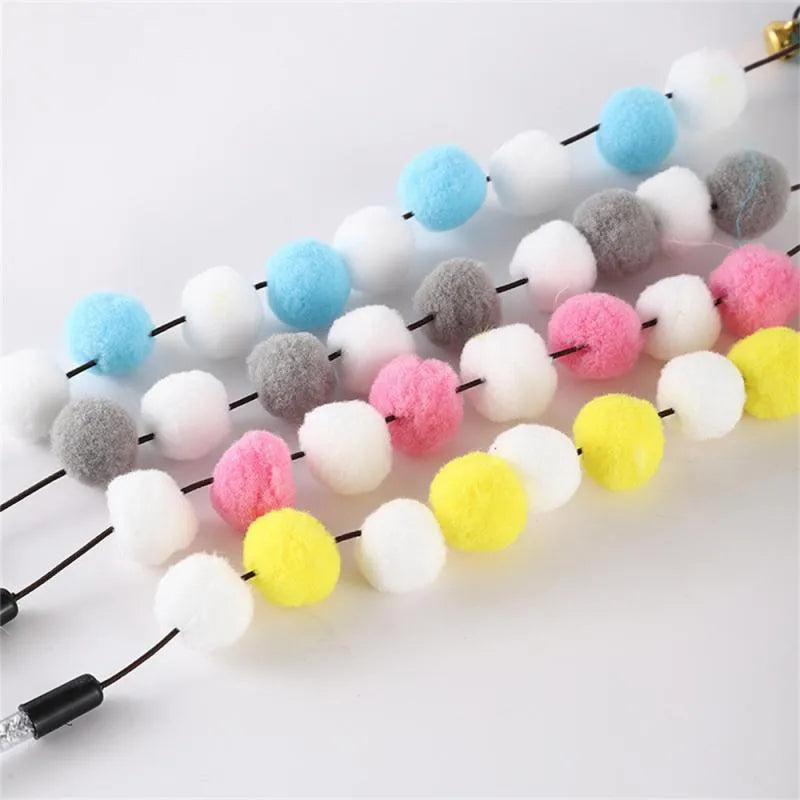 Colourful cat teaser toy rod with bell, feathers and pompons on 31cm stick