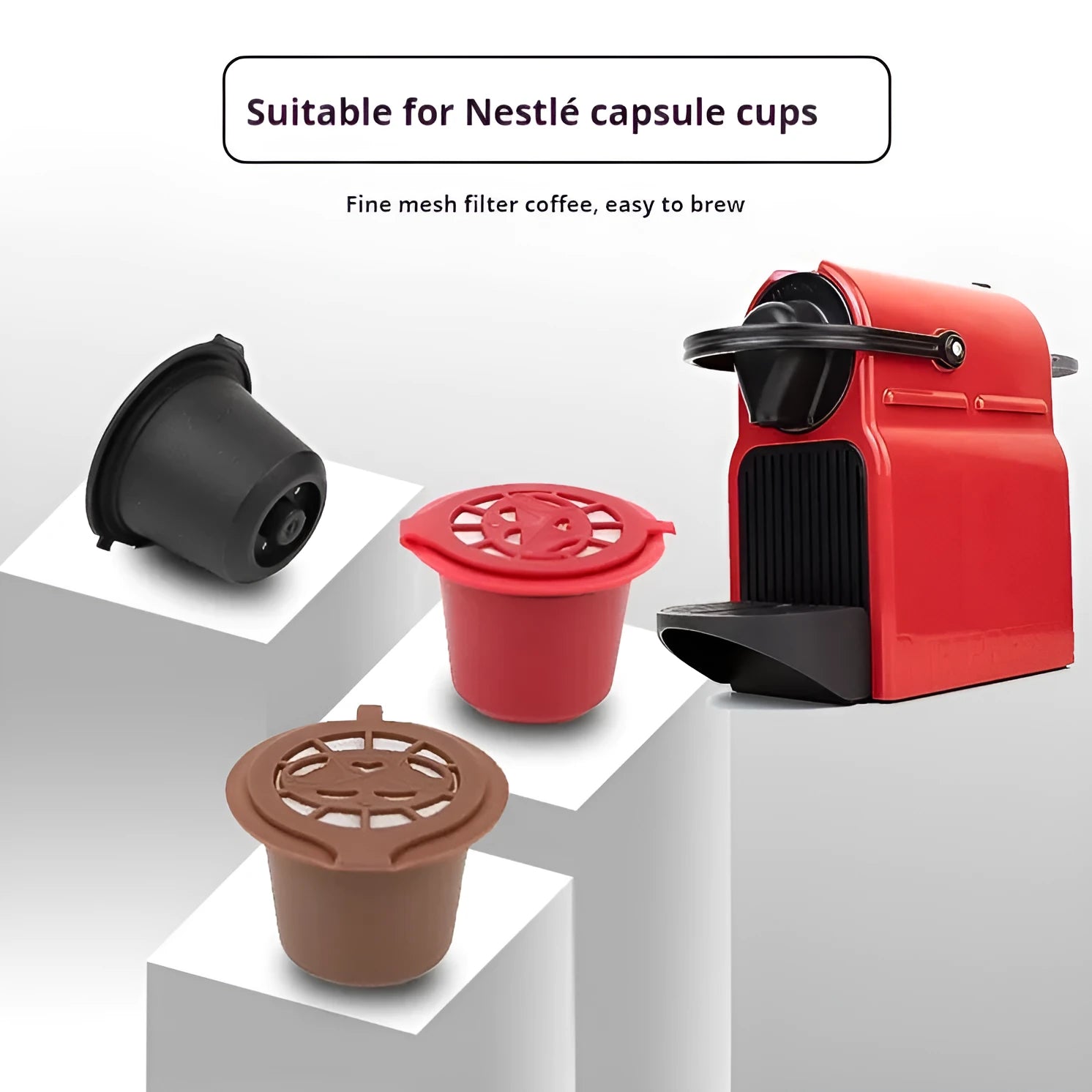 Six reusable black plastic coffee capsule filter cups with a spoon on a table