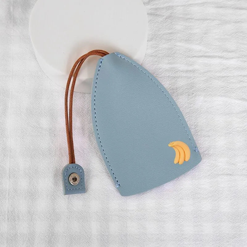 Cartoon pull-out key case in PU leather showing design options including resin fruit and big cartoon animal prints.