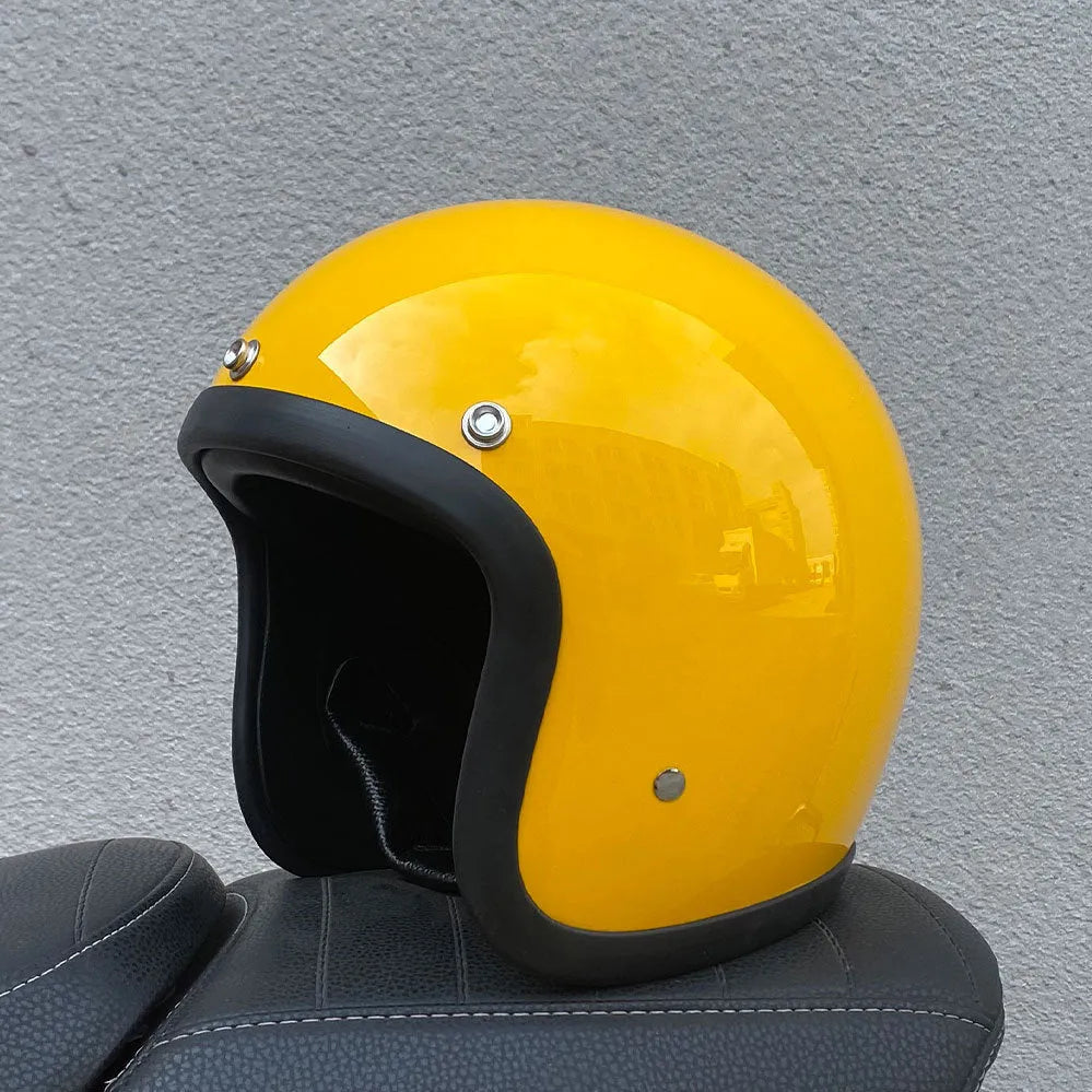 Retro-style half helmet for motorcycles with a fibreglass shell shown in a cement grey colour.