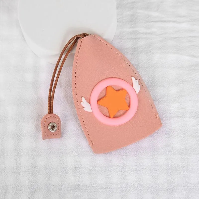 Cartoon pull-out key case in PU leather showing design options including resin fruit and big cartoon animal prints.