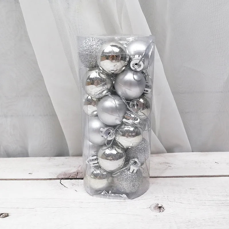 Shiny matte gold, red, silver, and blue 3 cm Christmas baubles spilling from a cardboard box.