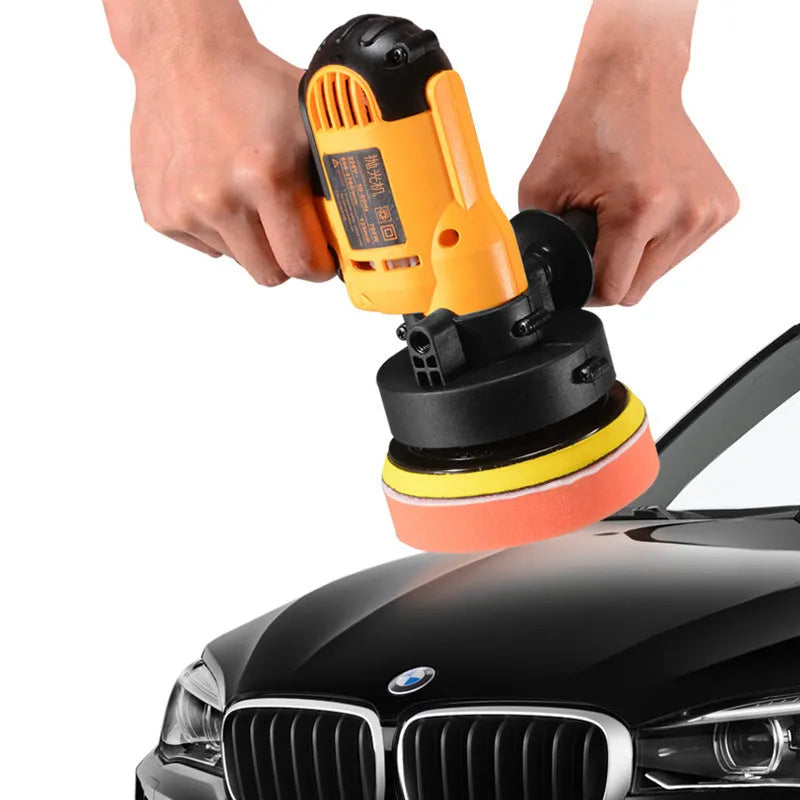 Yellow automotive polishing machine with 125mm disc on a workbench