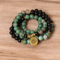 Green and black elastic beaded bracelet with alloy metal construction and natural style design