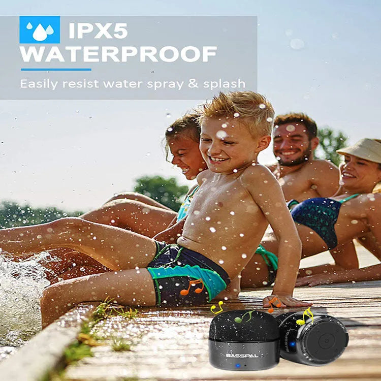 Black waterproof mini Bluetooth speaker showing button controls and compact portable design