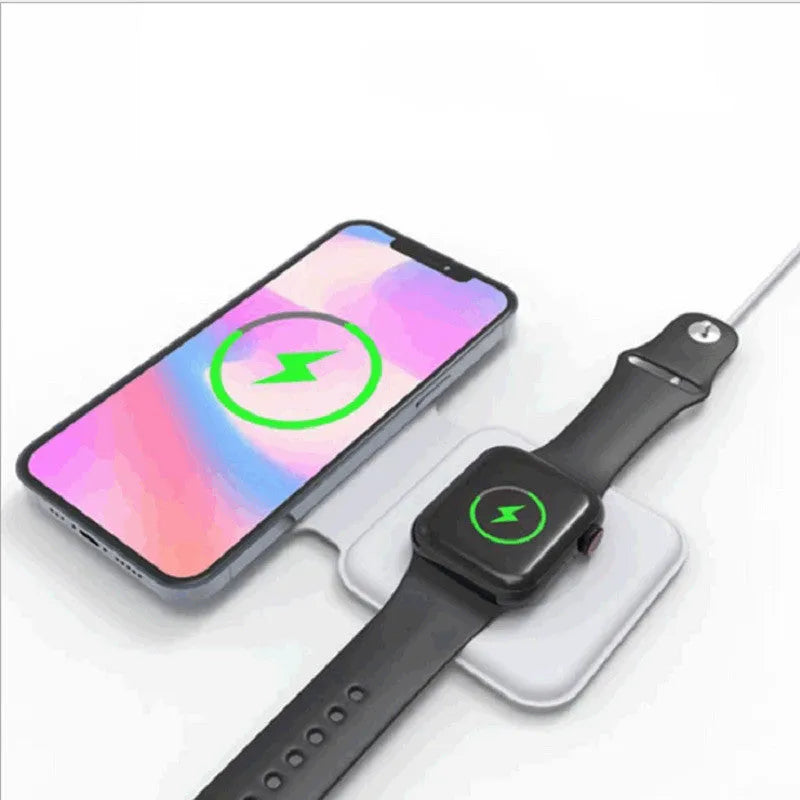 White foldable magnetic wireless charger charging two phones simultaneously on angled stand