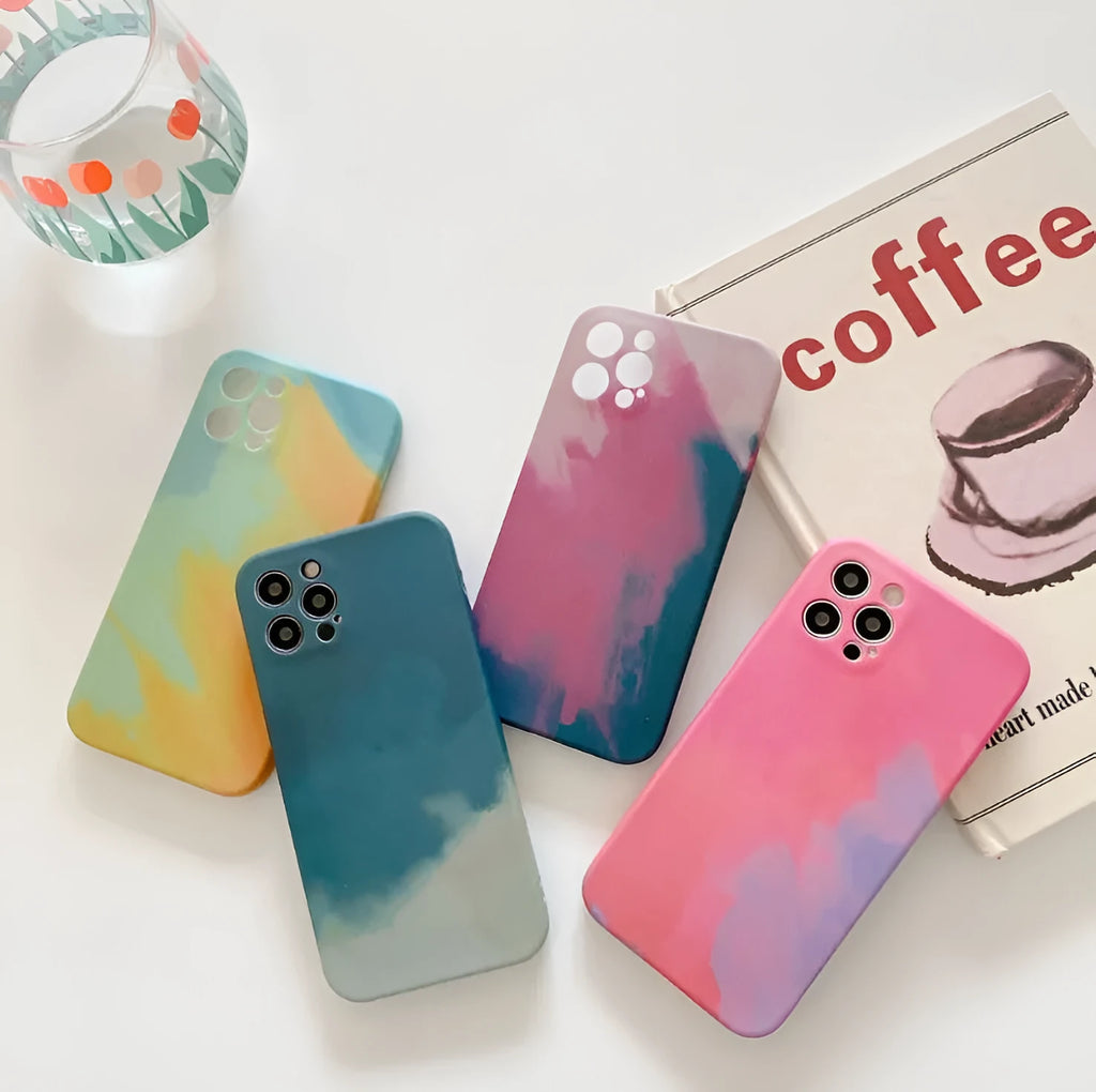 Soft silicone iPhone case with abstract blue gradient geometric design on a phone.